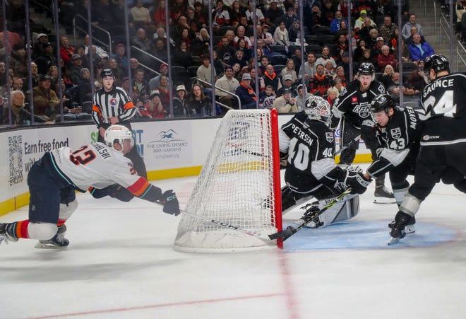 Andrew Poturalski scores with just over a minute left in the game for the Coachella Valley Firebirds to beat the Ontario Reign at Acrisure Arena in Palm Desert, Calif., Dec. 28, 2022. 